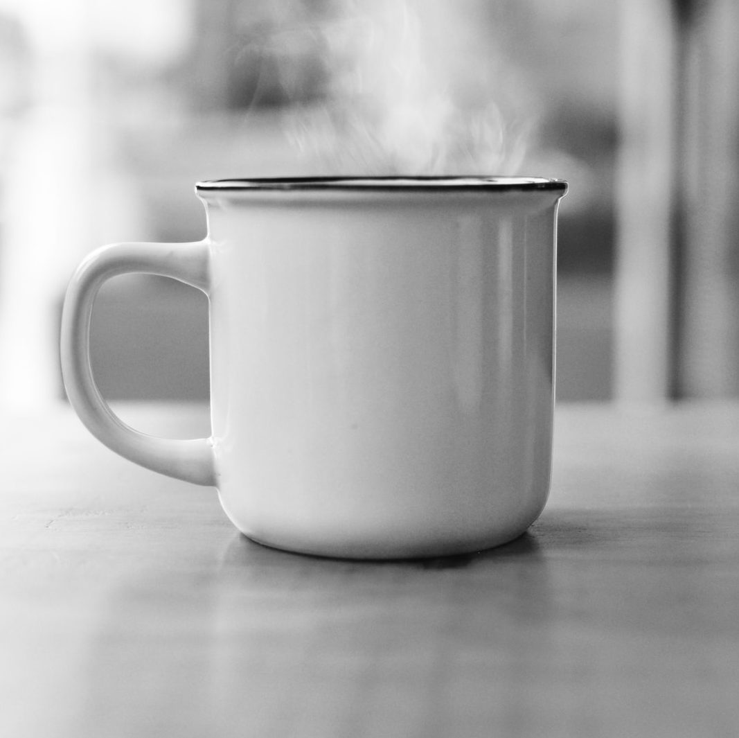 white ceramic mug on table surface
